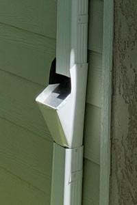 Downspout Cleanouts reduce clogs and make maintenance easy